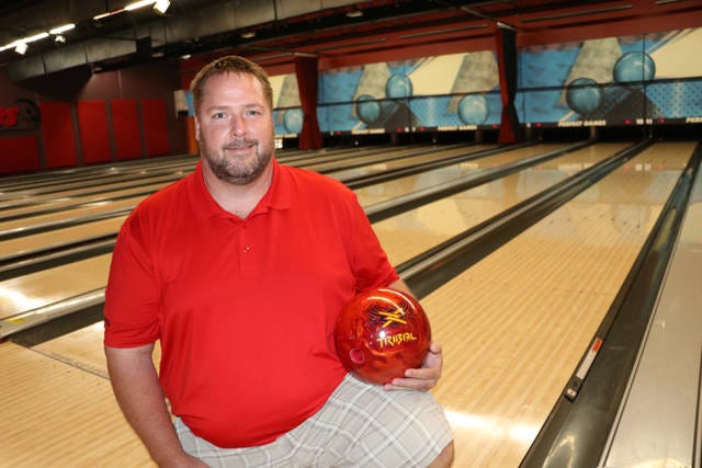 Jarad Prescott, of Maxwell, is this year’s winner of the Scratch All Events title in the Iowa USBC Championship Tournament. He poses here with the ball that helped him win. Photo by Marlys Barker