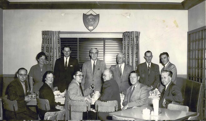 Standing: Mrs. Myrt Riggs, guest, Myrt Riggs, Mr. Runkel, Mayor John Werner, Paul Kennedy. Seated: Archie Branich, Mrs. Runkle, Art Michelin, Howard Spedding, Les Parks, unknown. Contributed photo