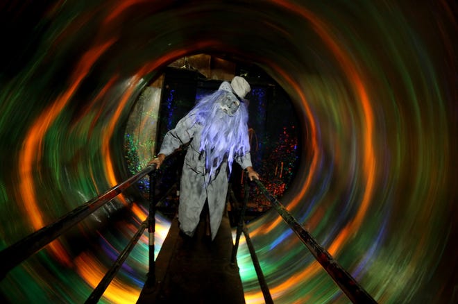 A spinning tunnel will make thrill-seekers feel disoriented while walking through scenes at the Haunted Pyramids. [Brittany Randolph/The Star]