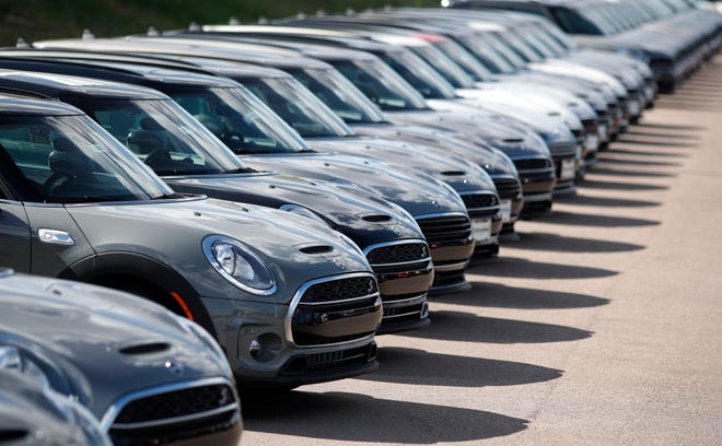 FILE - In this Aug. 25, 2019, file photo, a long line of unsold Clubman sports-utility vehicles sit at a Mini dealership in Highlands Ranch, Colo. On Friday, Sept. 13, the Commerce Department releases U.S. retail sales data for August. (AP Photo/David Zalubowski, File)
