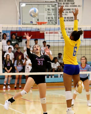 Southside's Bailey Vega looks to drop a shot over the net in the second set Thursday, Sept. 12, 2019, against North Little Rock at Southside. [JAMIE MITCHELL/TIMES RECORD]
