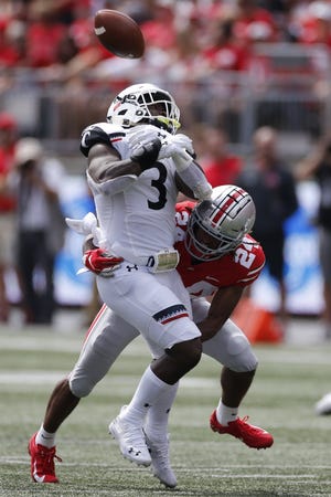 Defensive back Shaun Wade, breaking up a pass intended for Cincinnati's Michael Warren II last week, is among the 12 Ohio State players who were five-star prospects coming out of high school. Indiana has no former five-star players on its roster. [Jay LaPrete/The Associated Press]