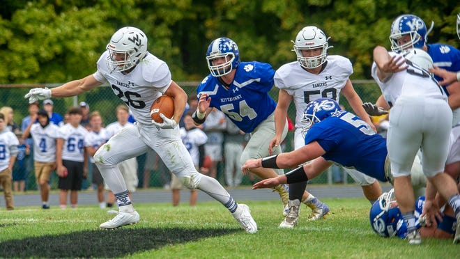 Wallkill Valley running back Ben Mizeski, left, breaks free during the team’s game against Kittatinny on Saturday at Wallkill Valley High School. Mizeski caught the game-winning touchdown, pulled down two interceptions and ran for 66 yards in the Rangers’ 22-21 win. [Photo by Warren Westura/New Jersey Herald (NJH)]
