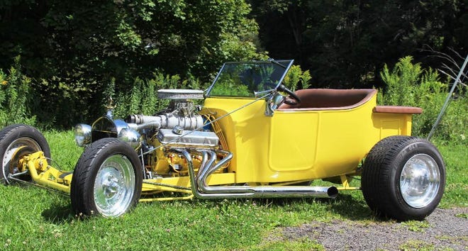 Reader Tony Karpovich is the proud owner of this beautiful T-Bucket Hot Rod, which he and his girlfriend Cindy Fenstermacher put together all by themselves. It features a supercharged 350 Chevy V8 and polished Centerline wheels all around. The front wheels are mounted on spindles from Tony’s grandfather’s 1954 Chevrolet sedan. [Karpovich Collection Photos]