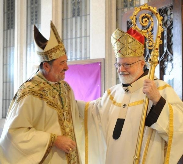 Bishop Edgar Moreira da Cunha, left, is welcomed to the Cathedral of St. Mary of the Assumption by Cardinal Sean Patrick O’Malley, Archbishop of Boston, for da Cunha’s installation in September 2014 as the eighth bishop of the Diocese of Fall River. [Herald news File Photo]