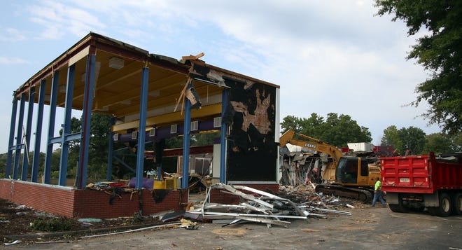 Demolition continued Tuesday morning, Sept. 17, 2019, on the old McDonald's building on South Main Street in Mount Holly. [Mike Hensdill/The Gaston Gazette]
