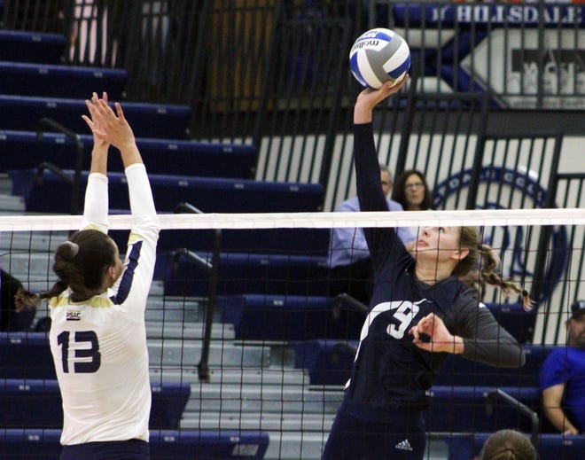 Hillsdale College's Allyssa Van Wienen (9) goes for a kill during Saturday's match against visiting Clarion. (JAMES GENSTERBLUM/Hillsdale Daily News)