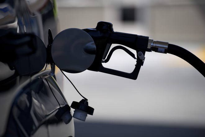 A gasoline nozzle is inserted into a car at a gas station in San Francisco on April 6, 2012. MUST CREDIT: Bloomberg photo by David Paul Morris.