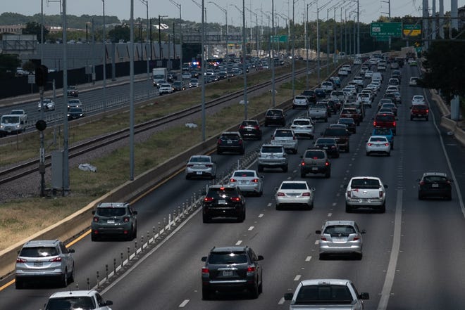 An accident in the southbound lane of MoPac near 45th Street caused traffic to back up in both directions on August 16. Texans are spending more time on the road due to increasing urban congestion, Margaret Spellings writes. [MARK MATSON for AMERICAN-STATESMAN]
