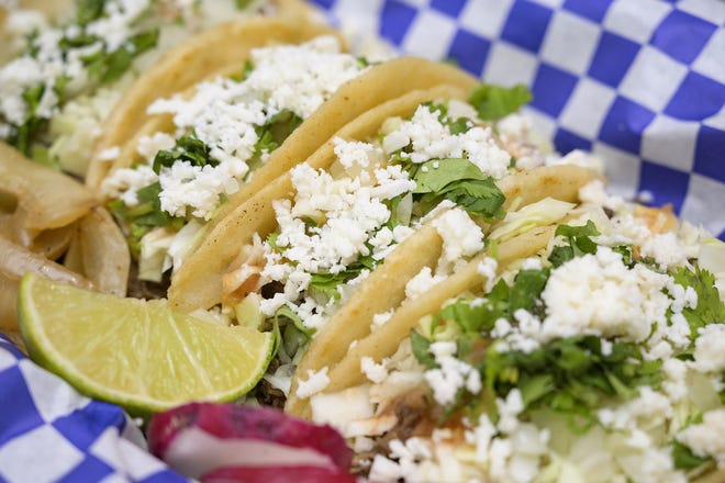 Taco Time offers tacos prepared three different ways: nayarit style (with cabbage, onion, cilantro and tomato sauce), norteno style (with onions, cilantro and tomato sauce) or supreme (with lettuce, tomato, cheese, tomato sauce and sour cream). [Cindy Sharp/Correspondent]