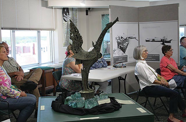 This phoenix statue was a focal point in the Shin’enKan garden. The blue green stones shown around the statue are artifacts from the home’s interior walls. Roseanne McKee/Journal-Capital