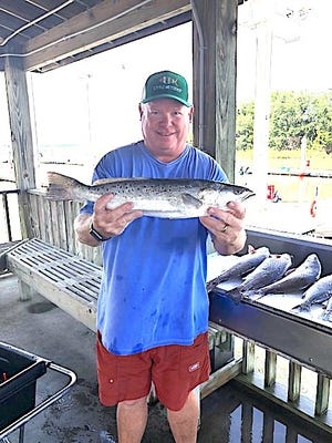 Savannah area angler Bill Bradley shows a 4.05-pound trout, one of five trout and reds weighing a total of 16.05 pounds he caught to take first place in the Savannah Sport Fishing Club’s General Tournament held Saturday. [SAVANNAH SPORTS FISHING CLUB]