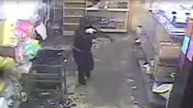 Polk County Sheriff's Office investigators are searching for two men who robbed the Harvest Meat Market on Kathleen Road in Lakeland last weekend. [SCREEN GRAB/PROVIDED VIDEO]
