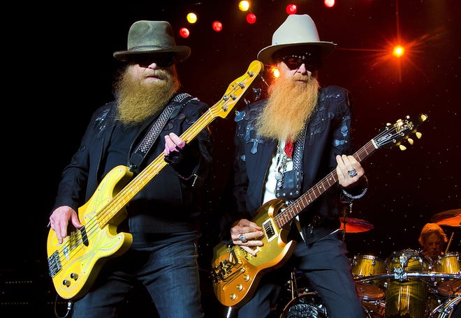 ZZ Top, left to right, Dusty Hill, Billy Gibbons and Frank Beard perform at Blue Hills Bank Pavilion on Sunday, August 28, 2016 in Boston. (Photo by Winslow Townson/Invision/AP)