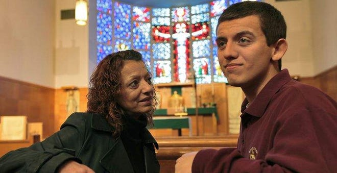 Mark Godding and his mother Joan are pictured in the Bishop Stang High School chapel in this 2011 photo taken by Standard-Times Photographer Peter Pereira.