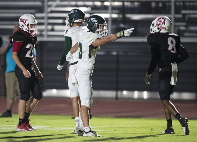 South Walton's Cade Roberts signals a first down after a play during Thursday's game at Tommy Oliver Stadium. [JOSHUA BOUCHER/THE NEWS HERALD]