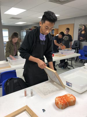 Future School art student Alex Morales makes handmade paper in Jessi Medeiros' class. Students are encouraged to participate in The Unexpected Chalk the Block activity on Saturday, Oct. 5. [PHOTO COURTESY OF JESSI MEDEIROS]