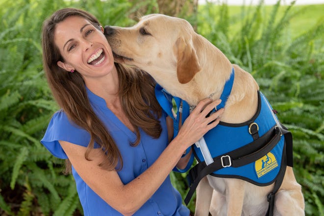 Harley, a dog with Canine Companions for Independence, is pictured with his handler, Melanie Lomaglio, a therapist with St. Augustine Rehabilitation Specialists. The two work exclusively with those afflicted with Parkinson's disease. [PHOTO COURTESY ST. AUGUSTINE REHABILITATION SPECIALISTS]