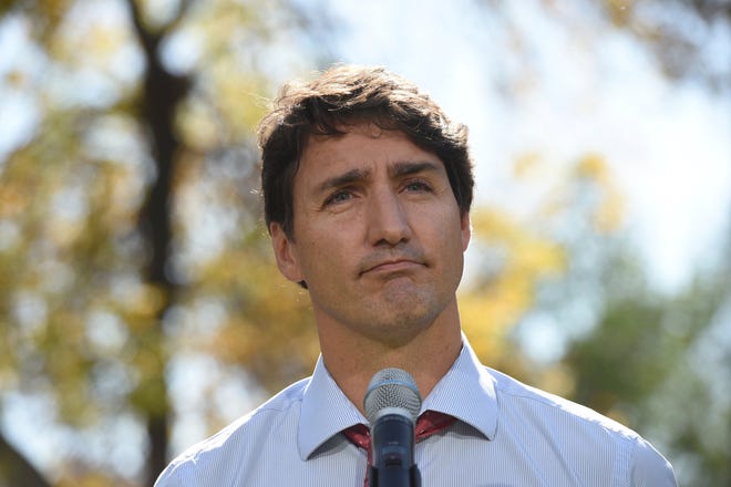 Canada's Prime Minister Justin Trudeau addresses the media in Winnipeg, Manitoba, Thursday, Sept. 19, 2019. Trudeau's campaign was hit Wednesday by the publication of a yearbook photo showing him in brownface makeup at a 2001 costume party. The prime minister apologized and said "it was a dumb thing to do." (Sean Kilpatrick/The Canadian Press via AP)