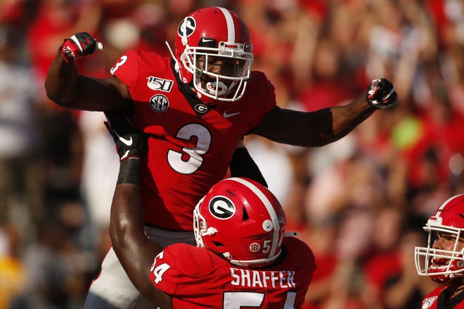 Georgia running back Zamir White (3) celebrates with offensive lineman Justin Shaffer (54) after scoring a touchdown against Murray State on Sept. 7 in in Athens. [JOSHUA L. JONES/ATHENS BANNER-HERALD FILE PHOTO]