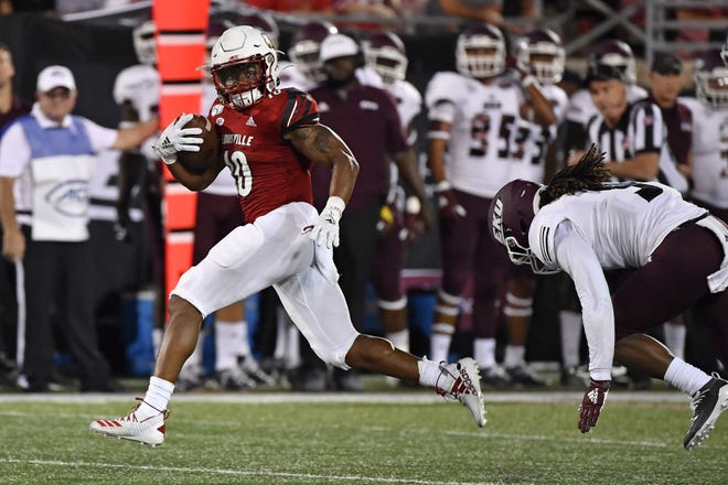 Louisville running back Javian Hawkins (10) runs from Eastern Kentucky defensive back Ben Bascom (9) during the second half of an NCAA college football game in Louisville, Ky., Sept. 7. [TIMOTHY D. EASLEY/AP PHOTO]