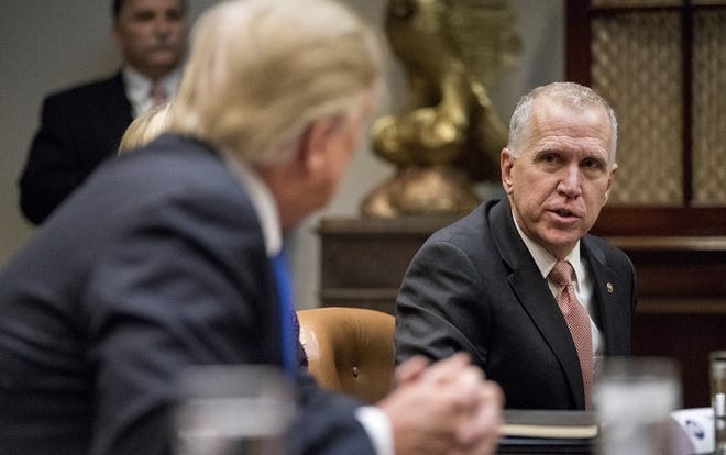 In February, U.S. Sen. Thom Tillis of North Carolina wrote an oped in The Washington Post opposing Donald Trump's declaration of a national emergency on the southern border, which would help secure funding for a wall. Tillis later changed his mind and supported the declaration, he says after talking with Trump officials. Some wall funding is designated to come out of the budget of Fort Bragg and other North Carolina military installations. [File photo/AP]