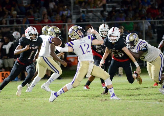 Ascension Catholic quarterback Bryce Leonard launches a long pass. Photo by Michael Tortorich.