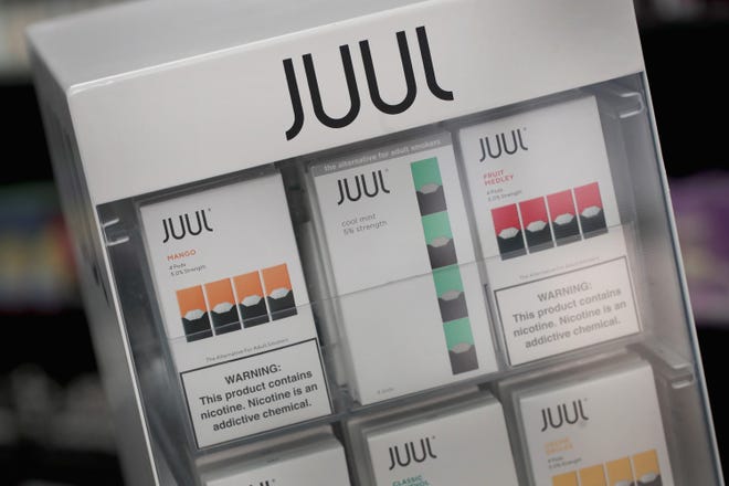 Electronic cigarettes and pods by Juul, the nation's largest maker of vaping products, are offered for sale at the Smoke Depot on Sept. 13, 2018 in Chicago. Five teens from Illinois are suing the company. (Photo by Scott Olson/Getty Images)