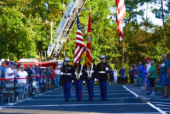 Fairfield HarbourþÄôs 9-11 Ceremony was opened by the U.S. Marine Color Guard presenting the Colors. Photo courtesy of Howard Neviser. [CONTRIBUTED PHOTO]