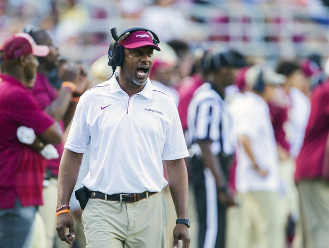 Florida State head coach Willie Taggart shouts instructions in the second half of an NCAA college football game against Louisville in Tallahassee on Saturday. [MARK WALLHEISER/AP PHOTO]
