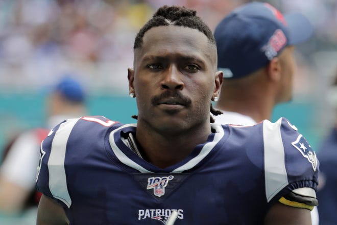 In this photo taken Sunday, New England Patriots wide receiver Antonio Brown (17) on the sidelines, during the first half against the Miami Dolphins in Miami Gardens, Fla. The Patriots released Brown on Friday. [AP Photo/Lynne Sladky, File]