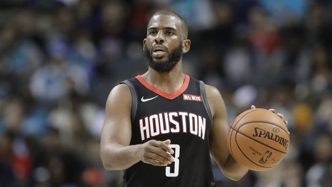 Guard Chris Paul, shown here with the Houston Rockets, is scheduled to start the season in Oklahoma City. But the Miami Heat have shown interest in acquiring the All-Star from the Thunder. [AP Photo/Chuck Burton]
