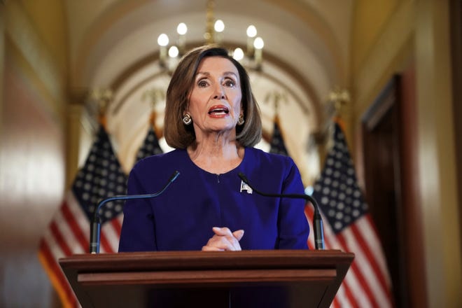 House Speaker Nancy Pelosi reads a statement announcing a formal impeachment inquiry into President Donald Trump on Capitol Hill on Tuesday in Washington. [Andrew Harnik/The Associated Press]