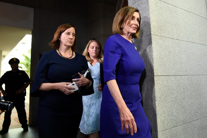 House Speaker Nancy Pelosi heads to a meeting with her caucus on Capitol Hill on Tuesday. [Susan Walsh/The Associated Press]