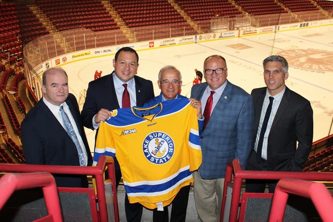 Lake Superior State will play a hockey game against Alabama-Huntsville at GFL Gardens in Sault, Ont. in February. Lake Superior State Director of Athletics David Paitson, Sault, Ont. Mayor Christian Provenzano, Sault Ste. Marie, Mich. Mayor Tony Bosbous, Lake Superior State President Dr. Rodney Hanley, and Lake Superior State hockey coach Damon Whitten are pictured from left to right. [LSSU photo]