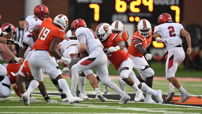 Cape Fear High graduate Justice Galloway-Velazquez (2, right) was named Big South Conference defensive player of the week after he had 14 tackles, forced two fumbles and recovered a fumble for Campbell in a 31-29 win Saturday night against Davidson. [Bennett Scarborough photo]
