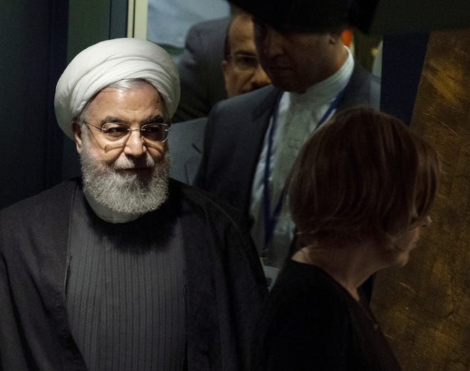 Iran's President Hassan Rouhani walks towards the podium before addressing the 74th session of the United Nations General Assembly Wednesday. [CRAIG RUTTLE/ASSOCIATED PRESS]