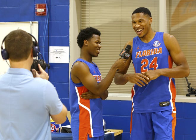 Kerry Blackshear Jr., right, laughs as he is jokingly interviewed by teammate Tyree Appleby during the team's media day on Tuesday in Gainesville. [Brad McClenny/GateHouse Florida]