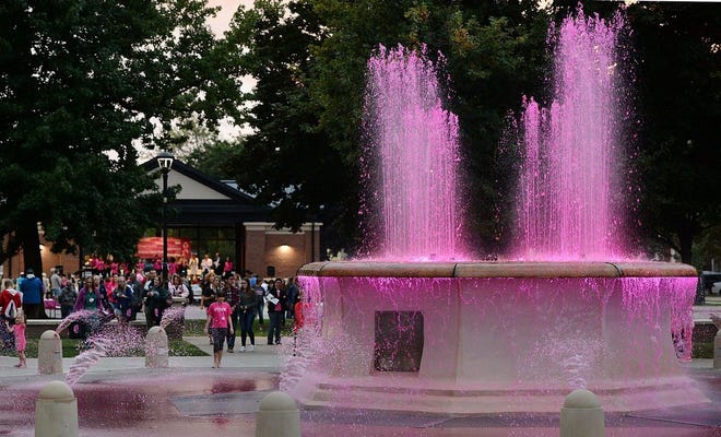 People move toward the fountain at East Perry Square after the City of Erie's ceremony recognizing Breast Cancer Awareness Month on Sept. 28, 2017. The 2019 Pink Perry Square event is scheduled for Oct. 1 at 6 p.m. [GREG WOHLFORD FILE PHOTO/ERIE TIMES-NEWS]