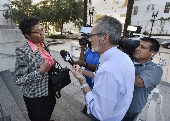 Former Jacksonville City Council member Katrina Brown talks with TV crews ooutside the federal courthouse this week as her federal fraud trial progresses. [Will Dickey/Florida Times-Union]
