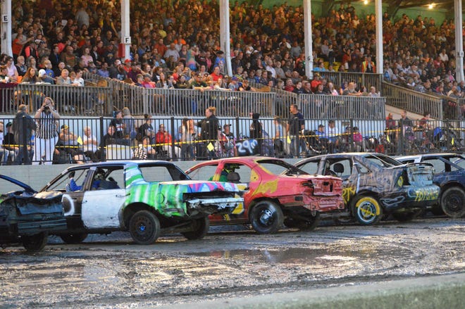 [SAM FRY PHOTO] TuesdayþÄôs demolition derby involved 91 vehicles, plus a handful of garden tractors which competed in a separate class.