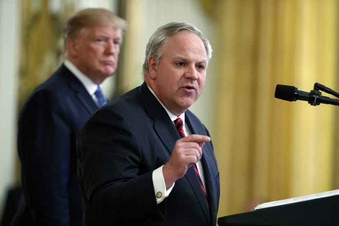 President Donald Trump listens July 8 as then-Secretary of the Interior David Bernhardt at an event on the environment in the East Room of the White House in Washington. In less than three years, Trump has named more former lobbyists to Cabinet-level posts than his most recent predecessors did in eight, putting a substantial amount of oversight in the hands of people with ties to the industries they regulate. [Evan Vucci/AP file]