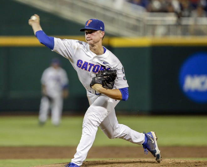 Florida's Brady Singer pitches during the NCAA College World Series on June 17, 2018, in Omaha, Neb. [AP Photo/Nati Harnik]