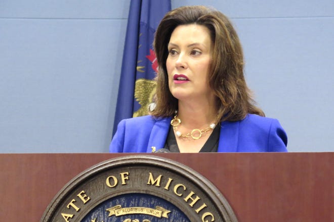 FILE - In this Aug. 28, 2019 file photo, Michigan Gov. Gretchen Whitmer speaks at a news conference in Lansing, Mich. Whitmer, a Democrat, is scrutinizing the Republican-led Legislature's proposed budget that includes shifting $400 million in general funds to road and bridge work. The move would impact other state spending. The deadline to sign or veto parts of the budget is midnight on Monday, Sept. 30. (AP Photo/David Eggert File)