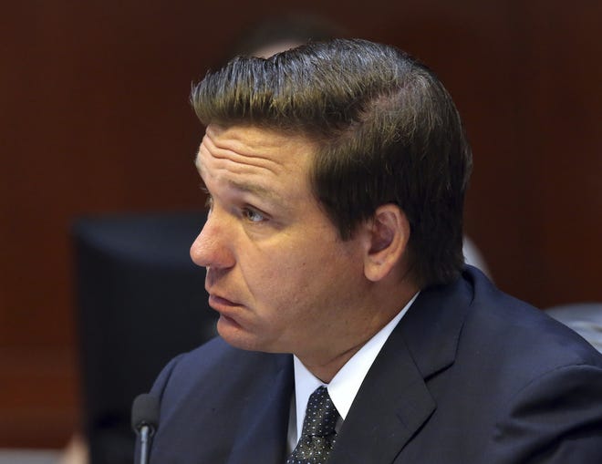 Florida Gov. Ron DeSantis listens to the proceedings during a Florida Cabinet meeting on June 4 in Tallahassee. [AP Photo/Steve Cannon]