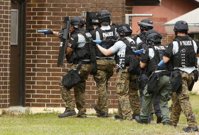 In this Feb. 20 file photo, officers with the Gainesville Police Department SWAT Team do tactical training. The police union has approved a new contract with the city of Gainesville. [Brad McClenny/The Gainesville Sun/File]