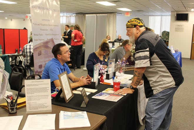Encore Financial Group of Cheboygan was one of the many vendors at the Benefits Fair, discussing different investment options and insurances available to the local veterans. Photo by Kortny Hahn