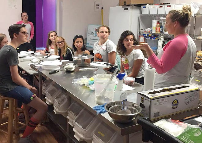 Students prepare to learn about cake decorating during a Thrive Clermont Summer PopUp session hosted by Twisted Flavors Baked Bar. [Thrive Clermont/Facebook]