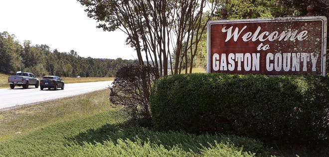 The current sign that welcomes motorists to Gaston County on U.S. 321 just past the Lincoln County line will be one of 20 that will be replaced by a new redesigned signs. [JOHN CLARK/THE GASTON GAZETTE]