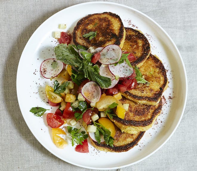 Tomatos and cucumbers star in this salad, which "Seeking the South" author Rob Newton served with green onion hoecakes. [Contributed by Emily Dorio]